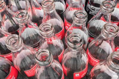 Coca cola bottles Empty glass bottles of Coca Cola, close-up. View from above. Italy February 19 2019. Copyright: xZoona-stock-foto