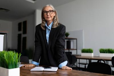 mature adult female accountant with gray hair in office mature adult female accountant with gray hair in office. ,model-stock-foto