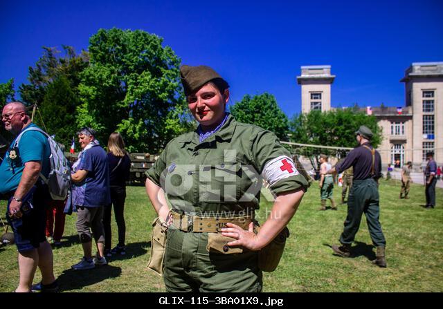 Reims, France, May 10, 2025 Historical reenactment of a 1945 American Allied military camp. It features costumed people, vehicles, weapons, logistics,