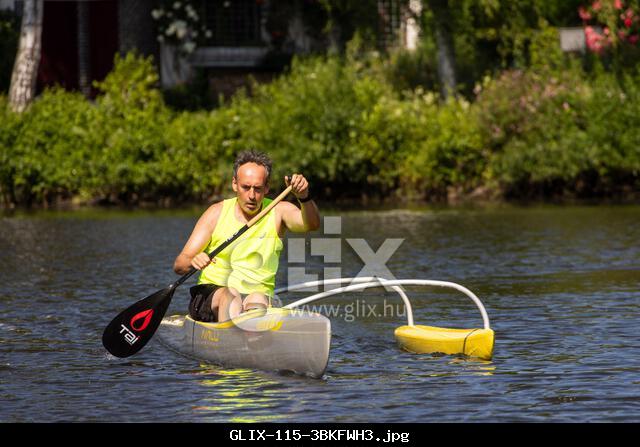 20 June 2025, Hesse, Gießen: A man trains in an outrigger canoe on the Lahn in Giessen. The Lahn is a popular spot for water sports enthusiasts. Photo: Christian Lademann/dpa
