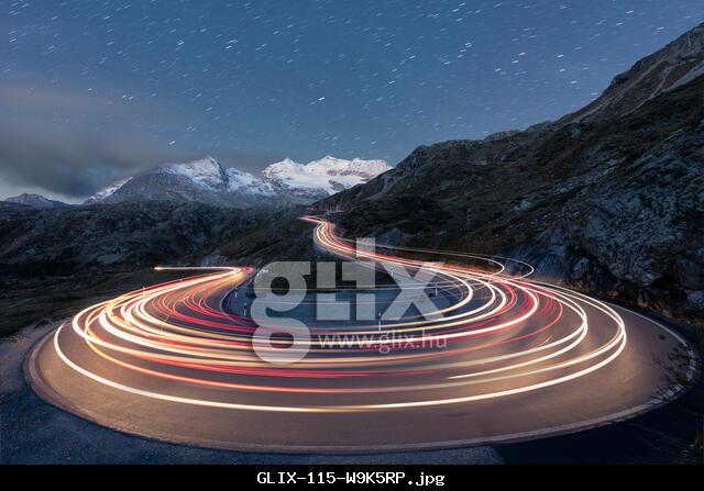 Star trail and lights of car traces, Bernina Pass, Poschiavo Valley, Engadine, Canton of Graubunden, Switzerland, Europe