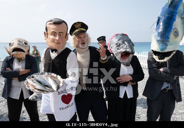 Nice, France. 9th June, 2025. Activists from Ocean Rebellion stage a street theatre protest in Nice. The performance features a performer in a caricature mask of President Emmanuel Macron, depicted as a servant to industrial fishing interests, with a man dressed as Captain Iglo (Captain Birdseye). The demonstration calls for an end to industrial fishing subsidies and a ban on trawling to protect marine biodiversity and traditional fishing communities. (Credit Image: © Joao Daniel Pereira/ZUMA Press Wire) EDITORIAL USAGE ONLY! Not for Commercial USAGE!