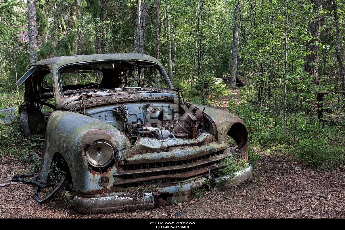 Auto graveyard in the forest, junk car, Kyrkö Mosse, near Ryd, Småland, Sweden