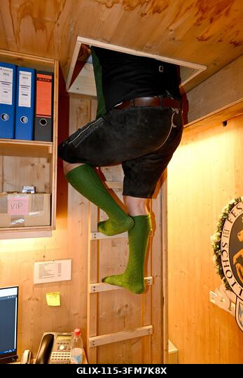 Munich, Germany. 27th Sep, 2026. Festival host Christian Schottenhamel climbs a ladder in the Schottenhamel festival hall to reach his sleeping box...