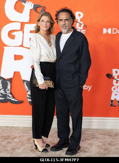 Los Angeles, USA. Sep. 28, 2026. María Eladia Hagerman, left, and Mexican filmmaker Alejandro G. Iñárritu arrive on the red carpet premiere of Digg...