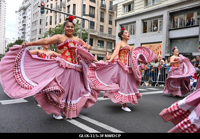 Madrid, Spain. 04th Oct, 2026. Participants in traditional costumes take part in the 2026 Hispanic Day parade on Gran Vía, Madrid. October 4, 2026,...